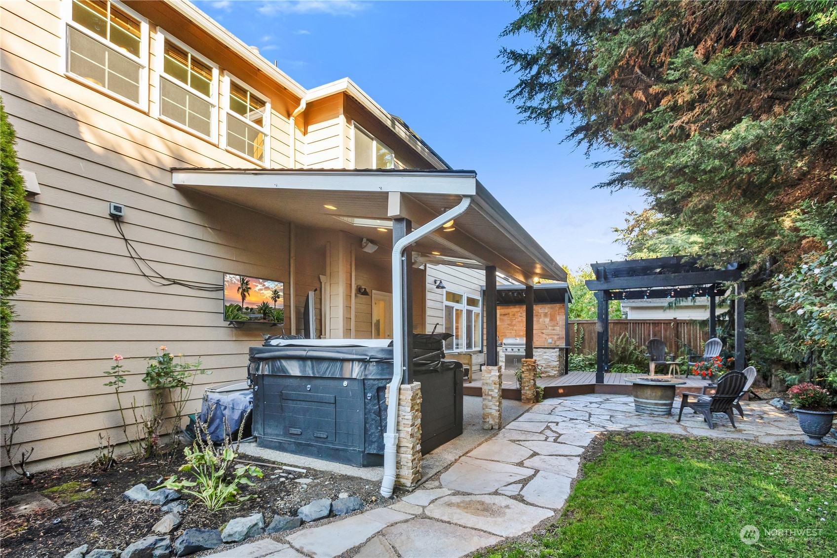 3210 187th Place Southeast Bothell, WA 98012 - Photo 32 of 39 a view of a house with sitting area and garden