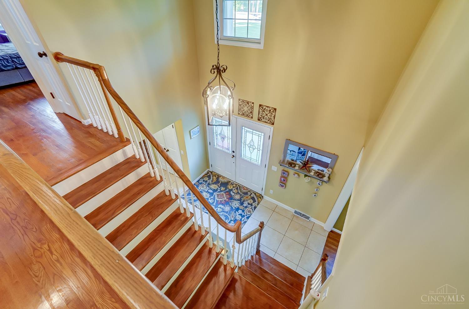 7272 Ayers Road Cincinnati, OH 45255 - Photo 24 of 54 Open foyer w/ chandelier. Extra window at the top allows more natural light.
