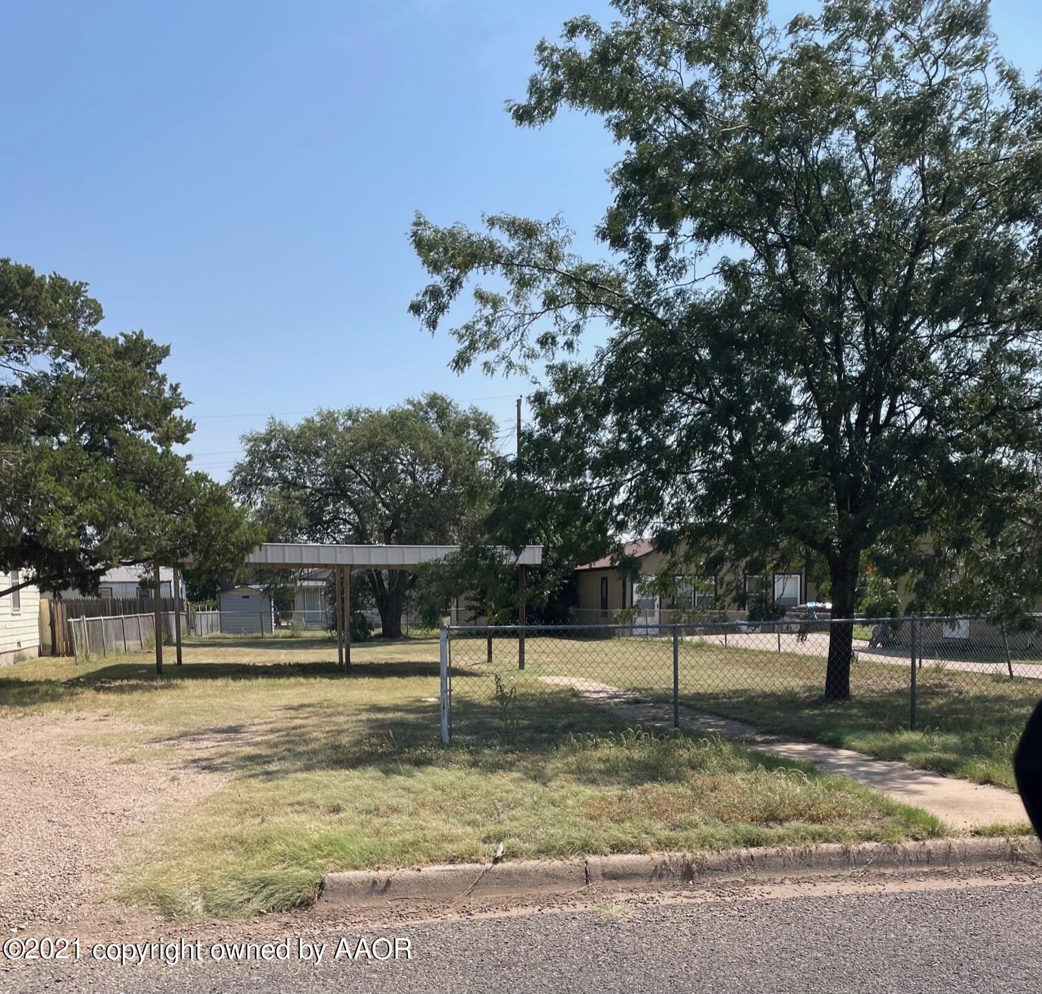 4201 South Tyler Street Amarillo, TX 79110 - Photo 3 of 27 a view of a yard with trees