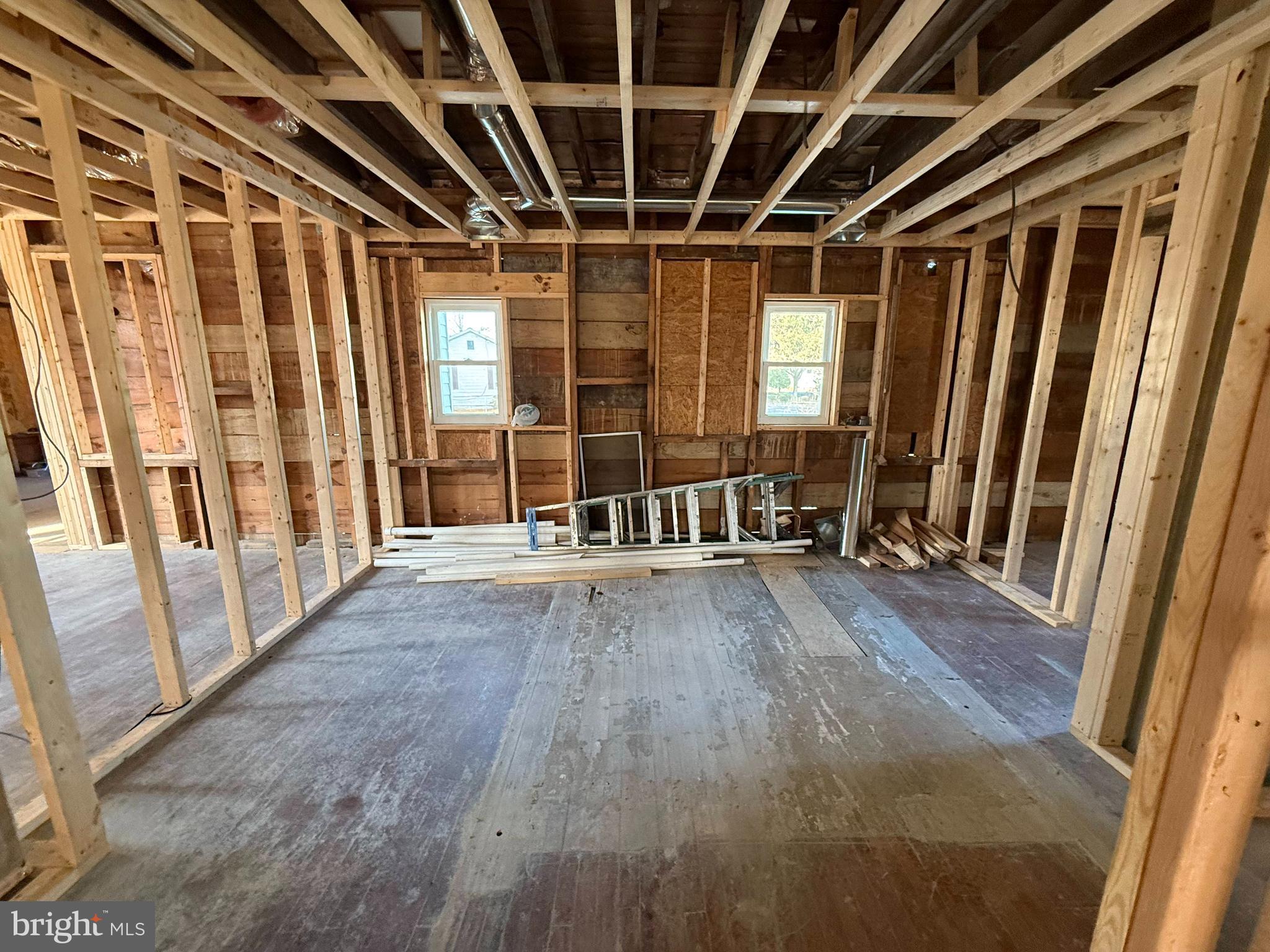 2224 Middleborough Road Essex, MD 21221 - Photo 28 of 36 a view of an empty room with wooden floor and windows