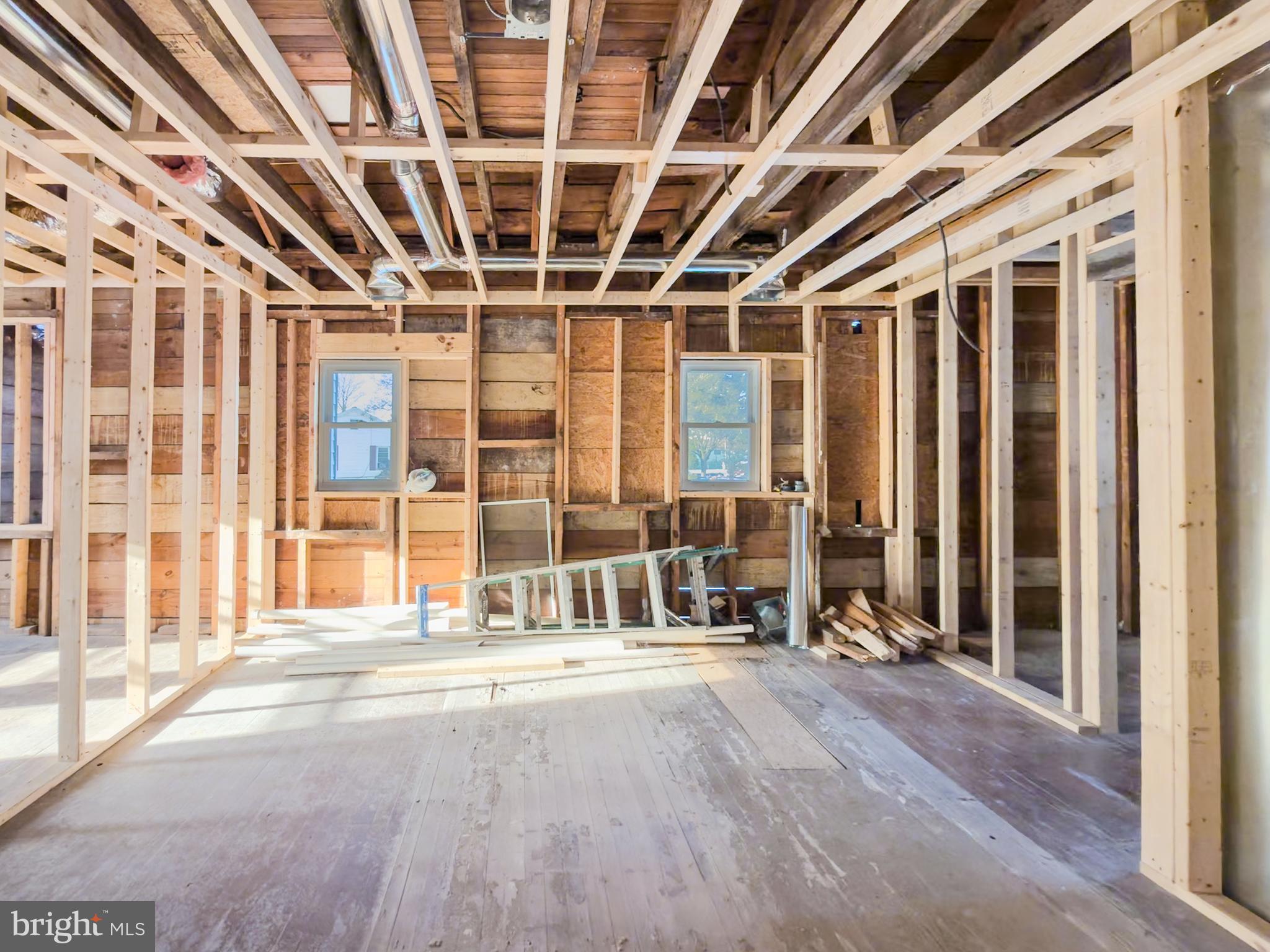 2224 Middleborough Road Essex, MD 21221 - Photo 6 of 50 a view of an empty room with wooden floor and door