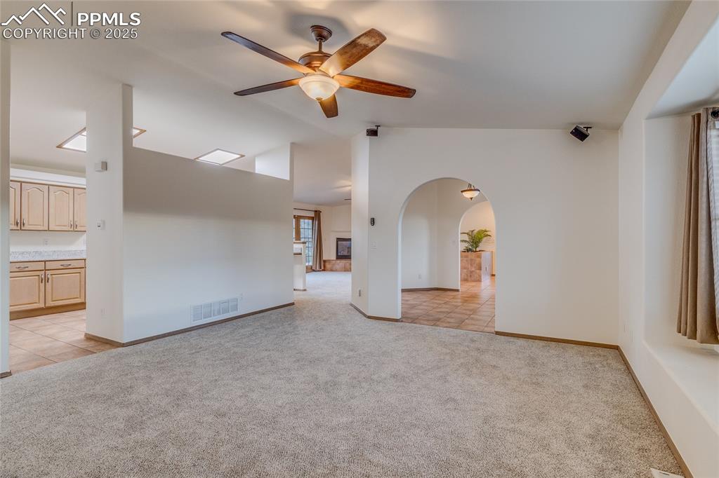 7501 Tudor Road Colorado Springs, CO 80919 - Photo 16 of 48 Living room with dining room to the right and kitchen on the left