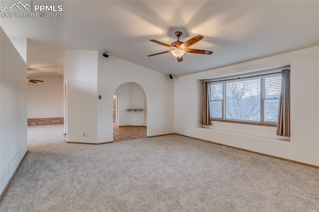 7501 Tudor Road Colorado Springs, CO 80919 - Photo 17 of 48 Living room with window seat and fantastic Pikes Peak and fron