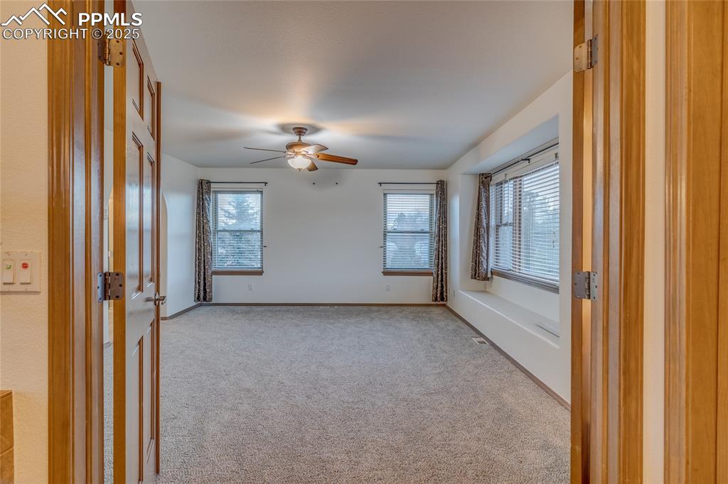 7501 Tudor Road Colorado Springs, CO 80919 - Photo 19 of 48 Double door entry to primary bedroom