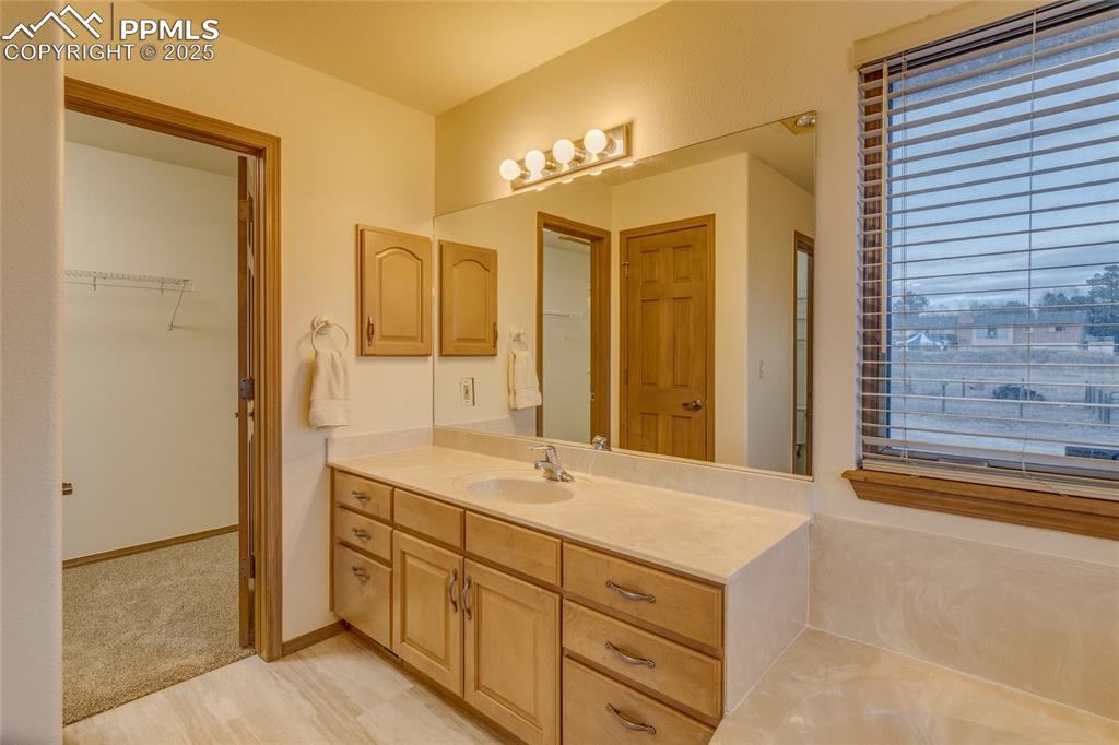 7501 Tudor Road Colorado Springs, CO 80919 - Photo 25 of 48 Primary bathroom with large walk in closet