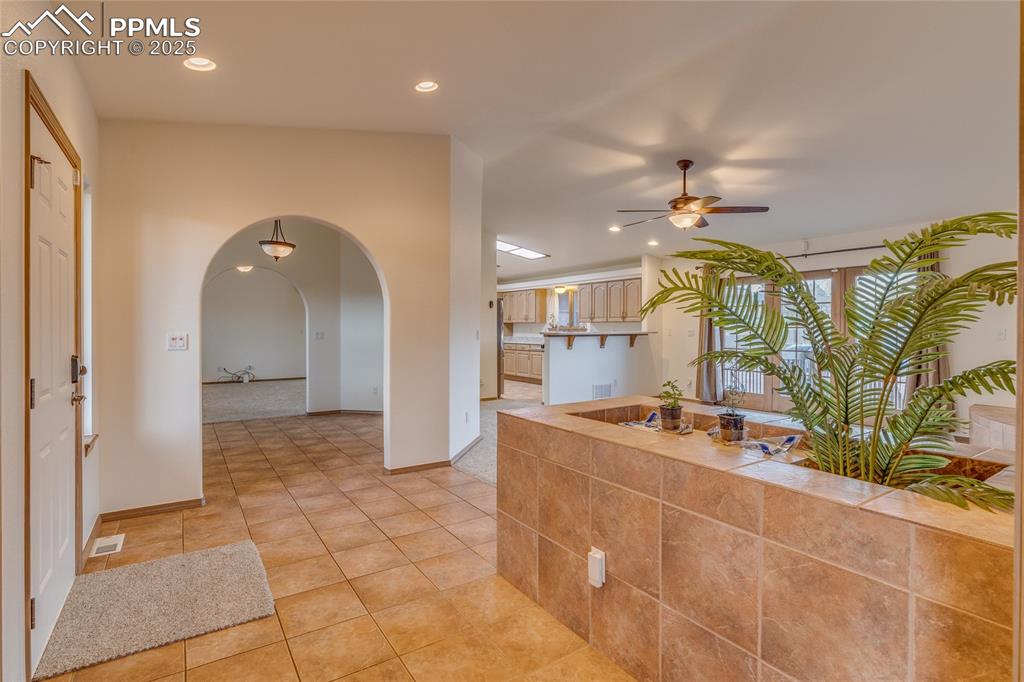 7501 Tudor Road Colorado Springs, CO 80919 - Photo 7 of 48 From double door entry to primary bedroom looking toward dining room - kitchen and family room to the right
