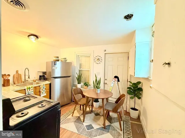 a view of a workspace with furniture