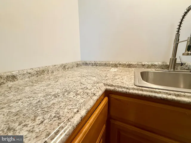 a view of a room with wooden floor and cabinet