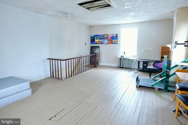 a bedroom with bed and a window