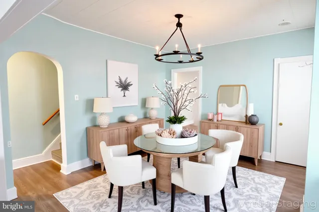 a dining room with furniture and wooden floor