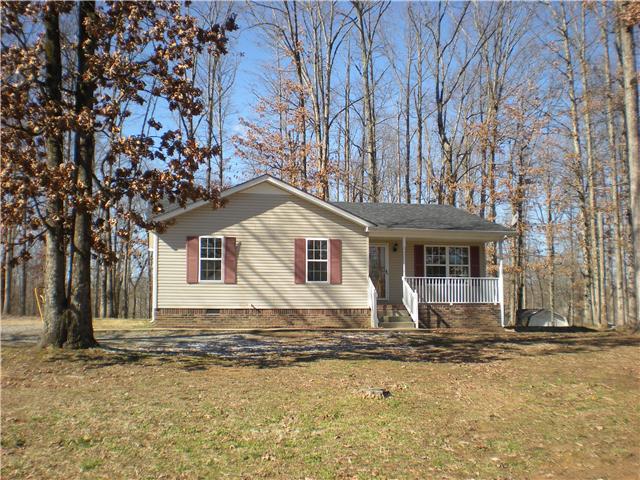 1008 Wildcat Road Dickson, TN 37055 - Photo 1 of 12 a house that has a tree in front of it