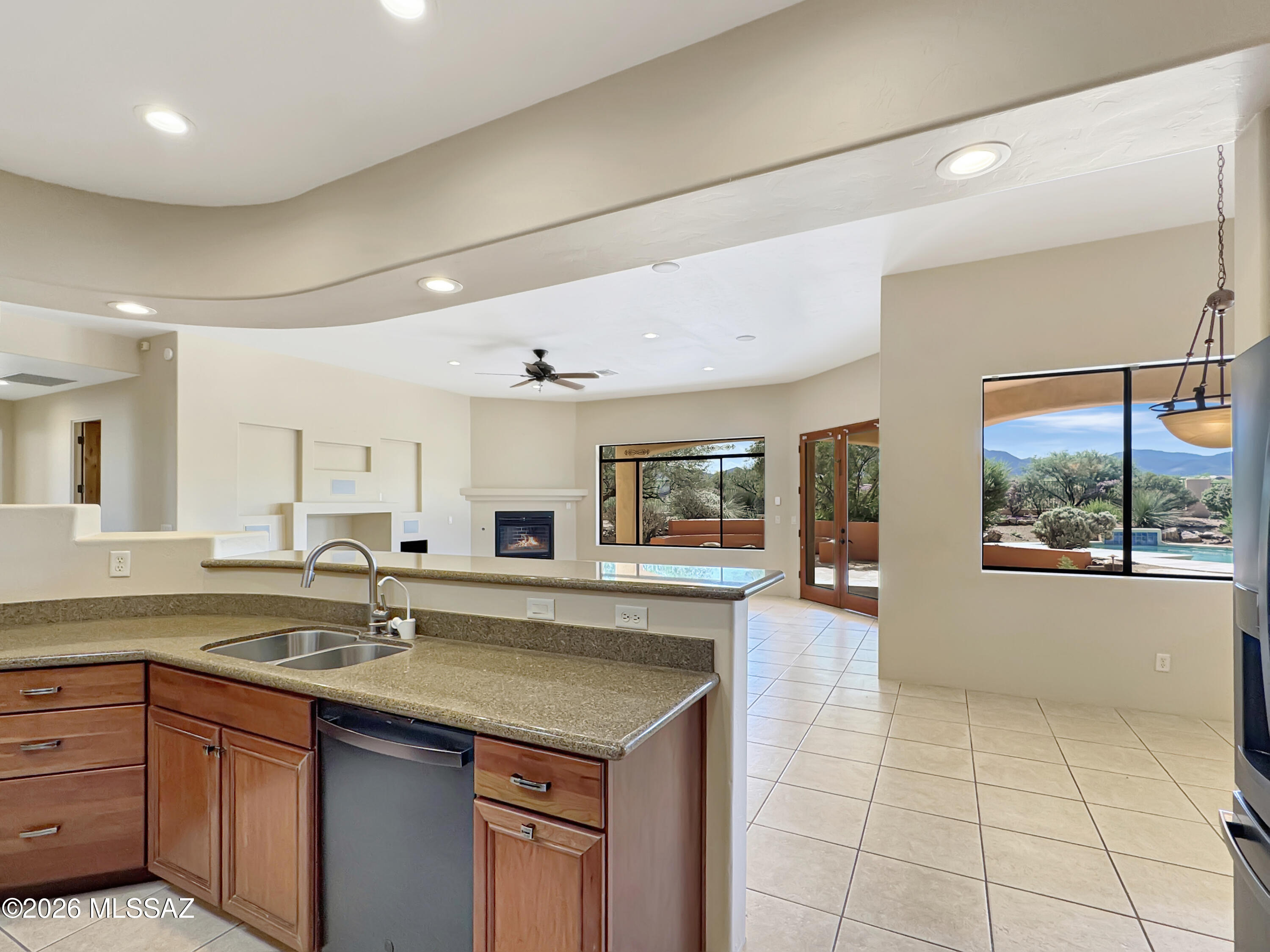16781 Sycamore Ridge Trail Vail, AZ 85641 - Photo 11 of 50 Reverse osmosis at kitchen sink and black satin finish fridge