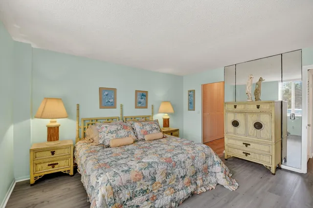 a bedroom with a bed and a closet