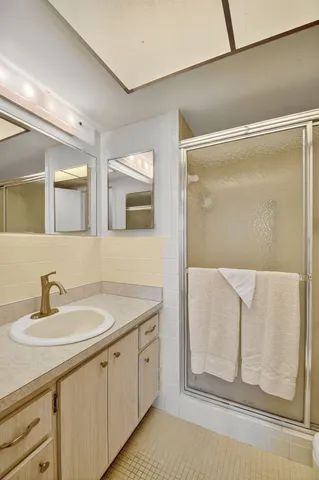 a bathroom with a sink and mirror