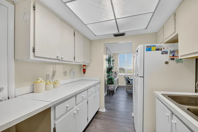 a kitchen with refrigerator and car