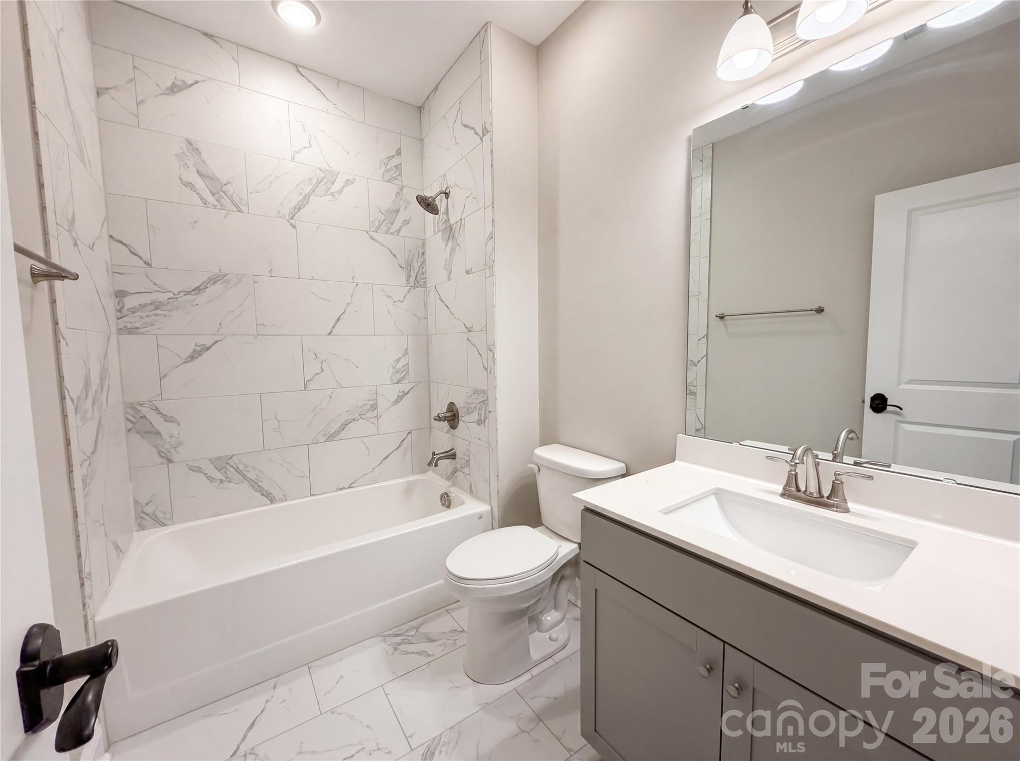 1321 Fishing Creek Road Clover, SC 29710 - Photo 10 of 19 a bathroom with a sink a toilet and a bathtub