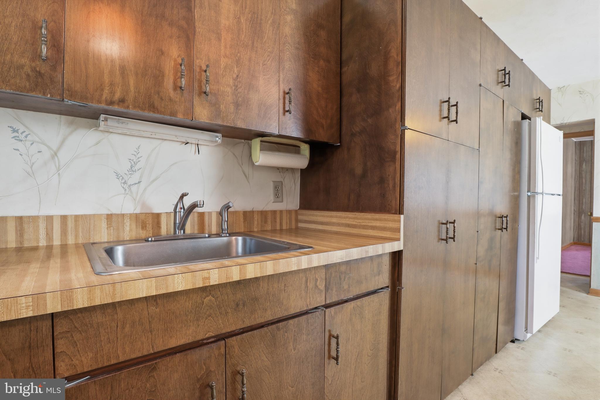 543 Baer Avenue Hanover, PA 17331 - Photo 13 of 51 a kitchen with stainless steel appliances granite countertop a sink and a refrigerator