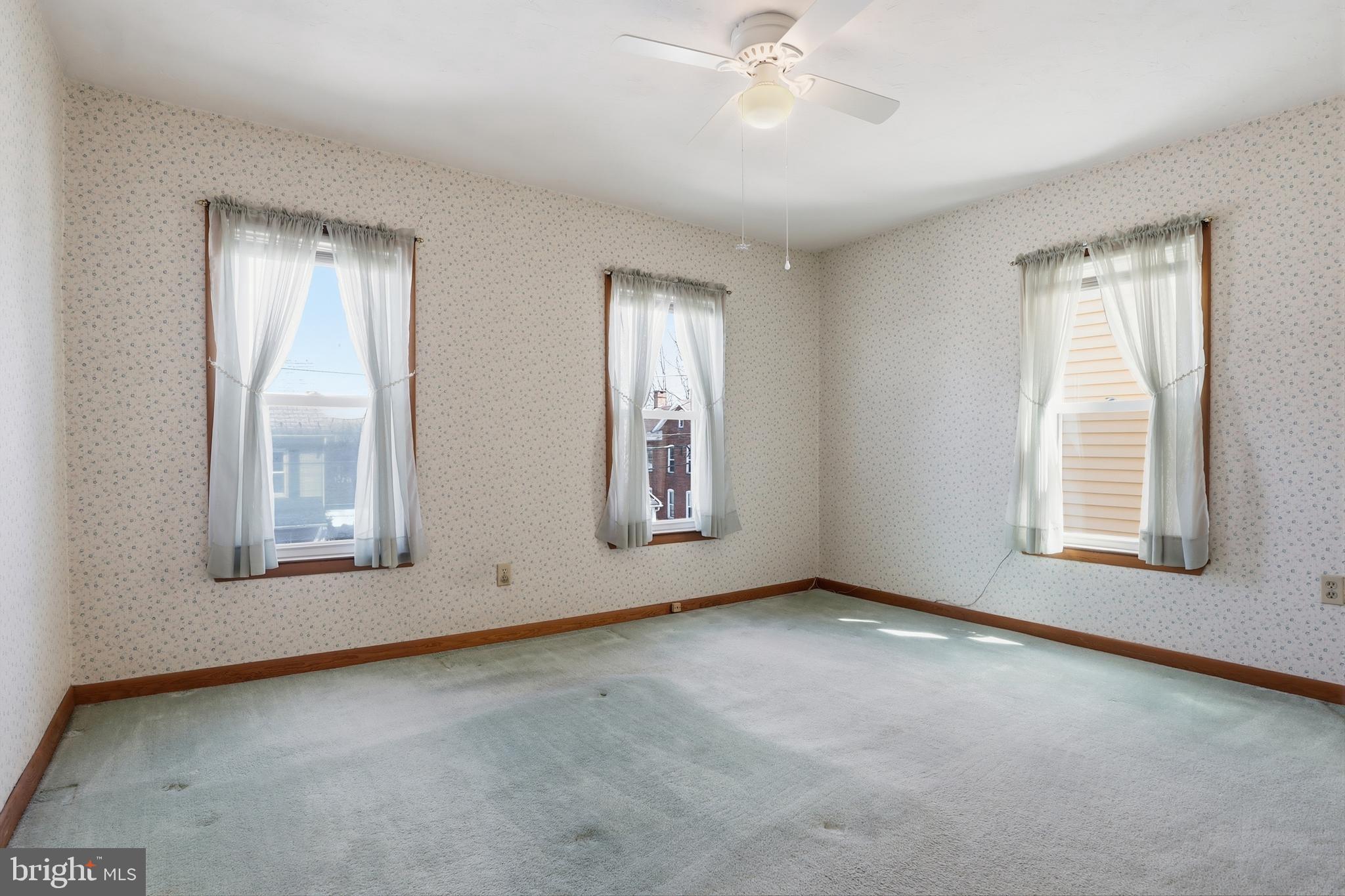543 Baer Avenue Hanover, PA 17331 - Photo 24 of 51 a view of an empty room with chandelier fan and fire place