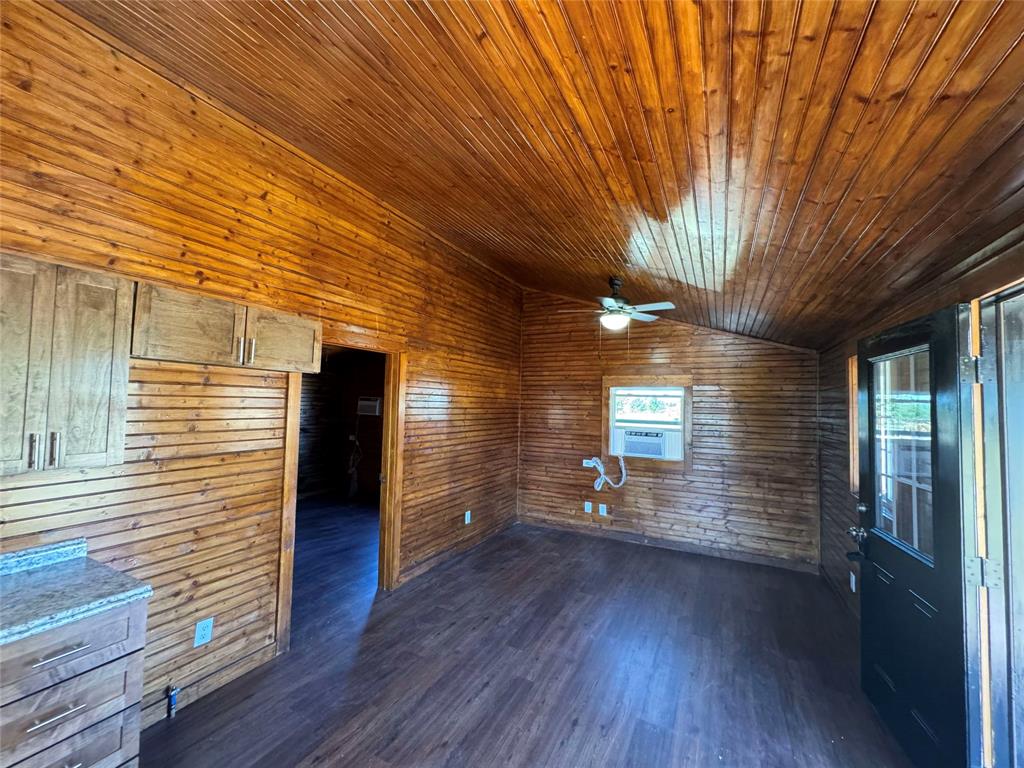184 County Road Pattonville, TX 75468 - Photo 16 of 20 an empty room with wooden floor and windows