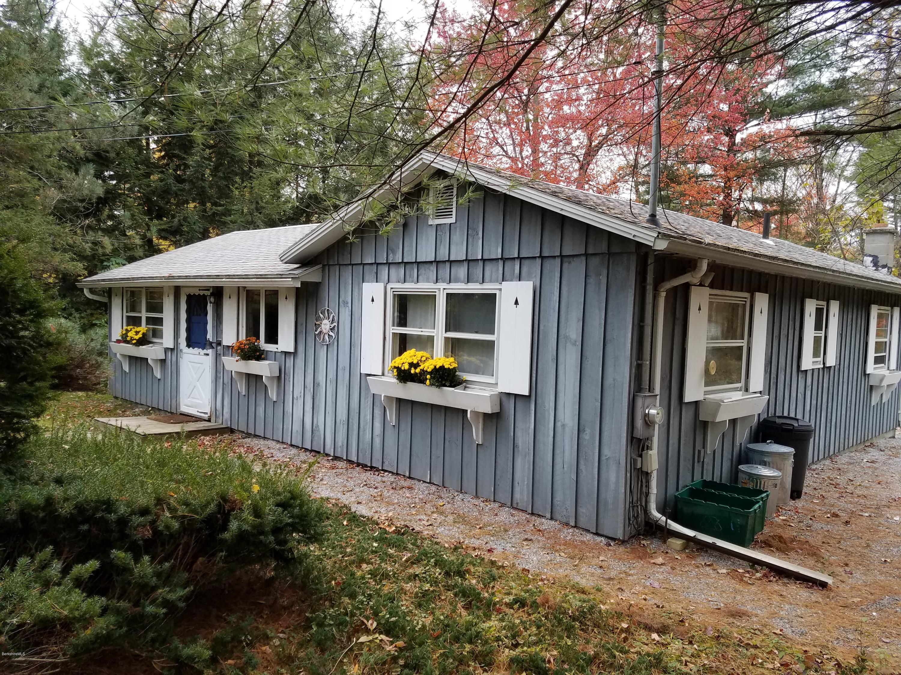 70 Hemlock Road Richmond, MA 01201 - Photo 1 of 9 a front view of a house with balcony