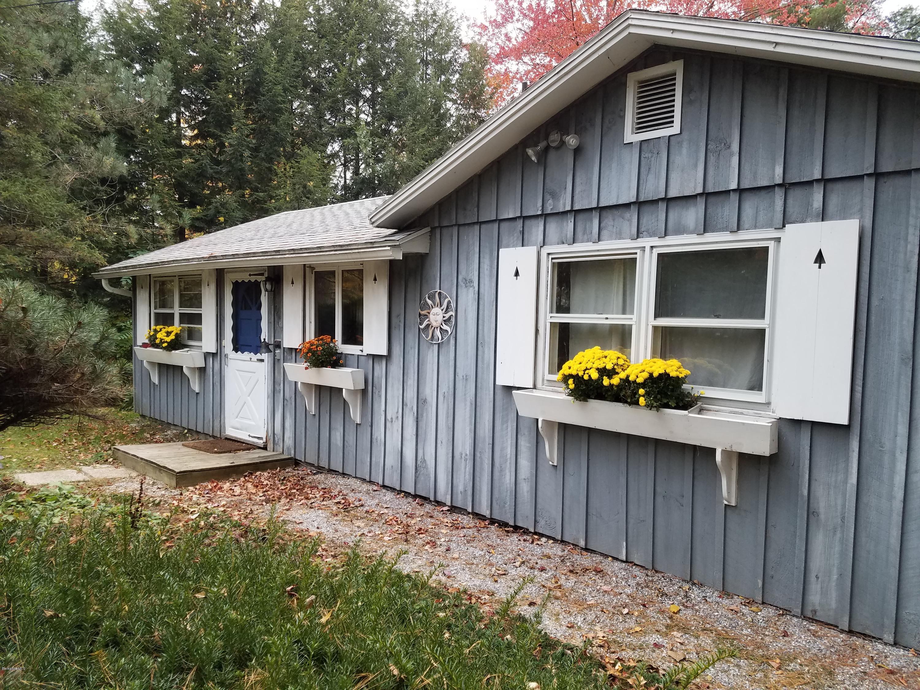 70 Hemlock Road Richmond, MA 01201 - Photo 2 of 9 a front view of a house with patio