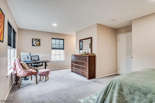 a bedroom with a bed and a mirror