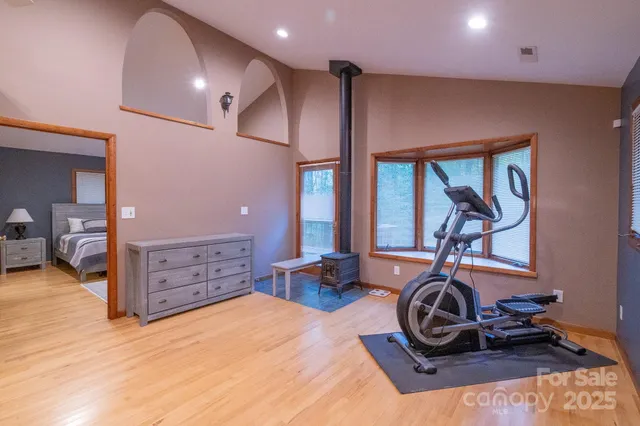 a room with gym equipment and a large window