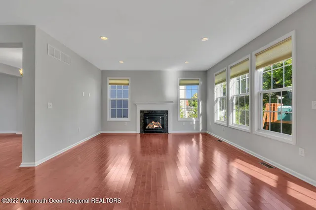 a view of kitchen and dining room with wooden floor