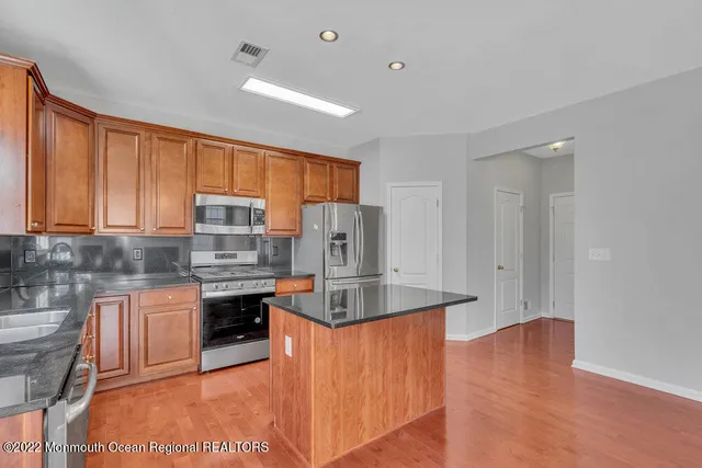 a bathroom with a sink a mirror and a toilet