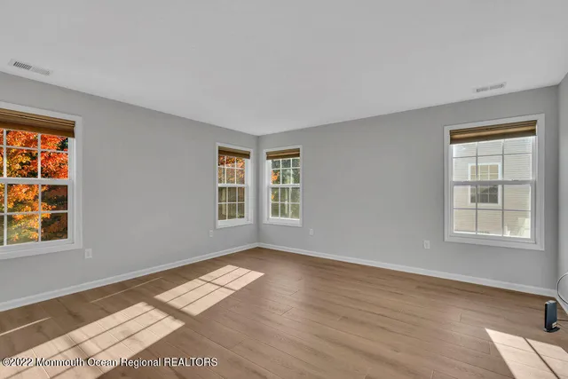 a bathroom with a granite countertop sink and a bathtub