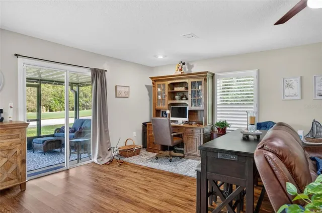a dining room with furniture a rug a table and chairs
