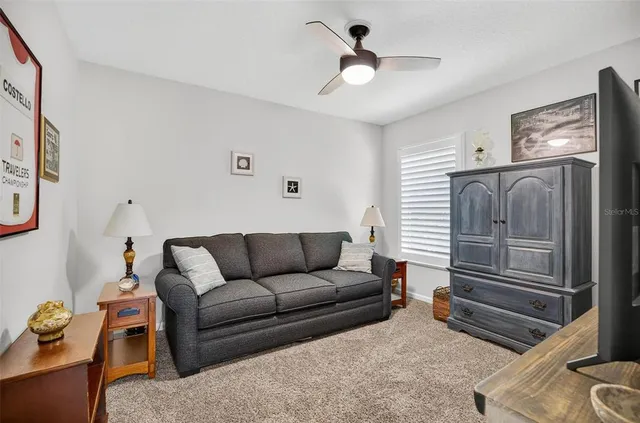 a bedroom with a bed and a flat tv screen