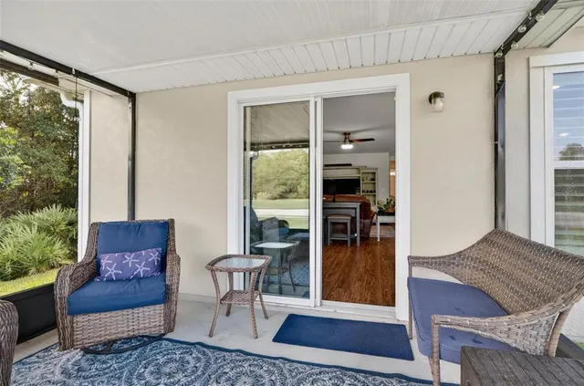 a front view of a house with a garden and trees