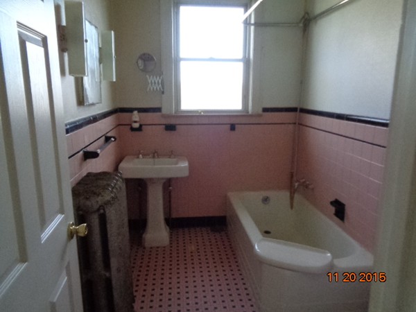 2 Albion Street Salem, MA 01970 - Photo 7 of 10 a bathroom with a bathtub sink and toilet