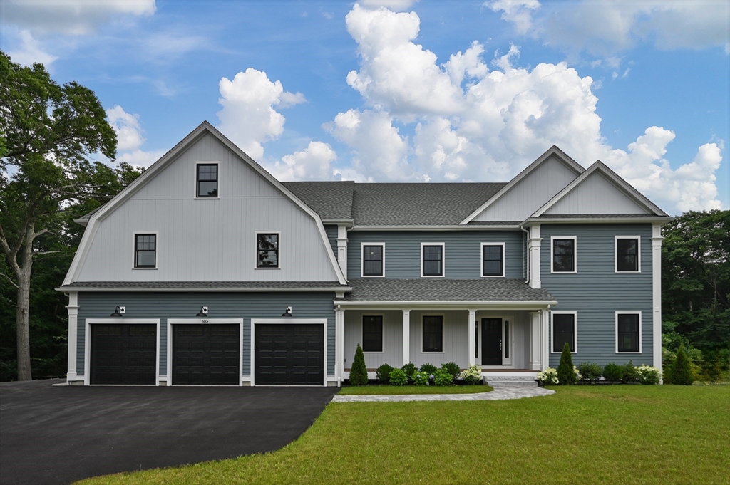 585 Lowell Street, Unit 1 Lexington, MA 02420 - Photo 1 of 1 a front view of a house with garden