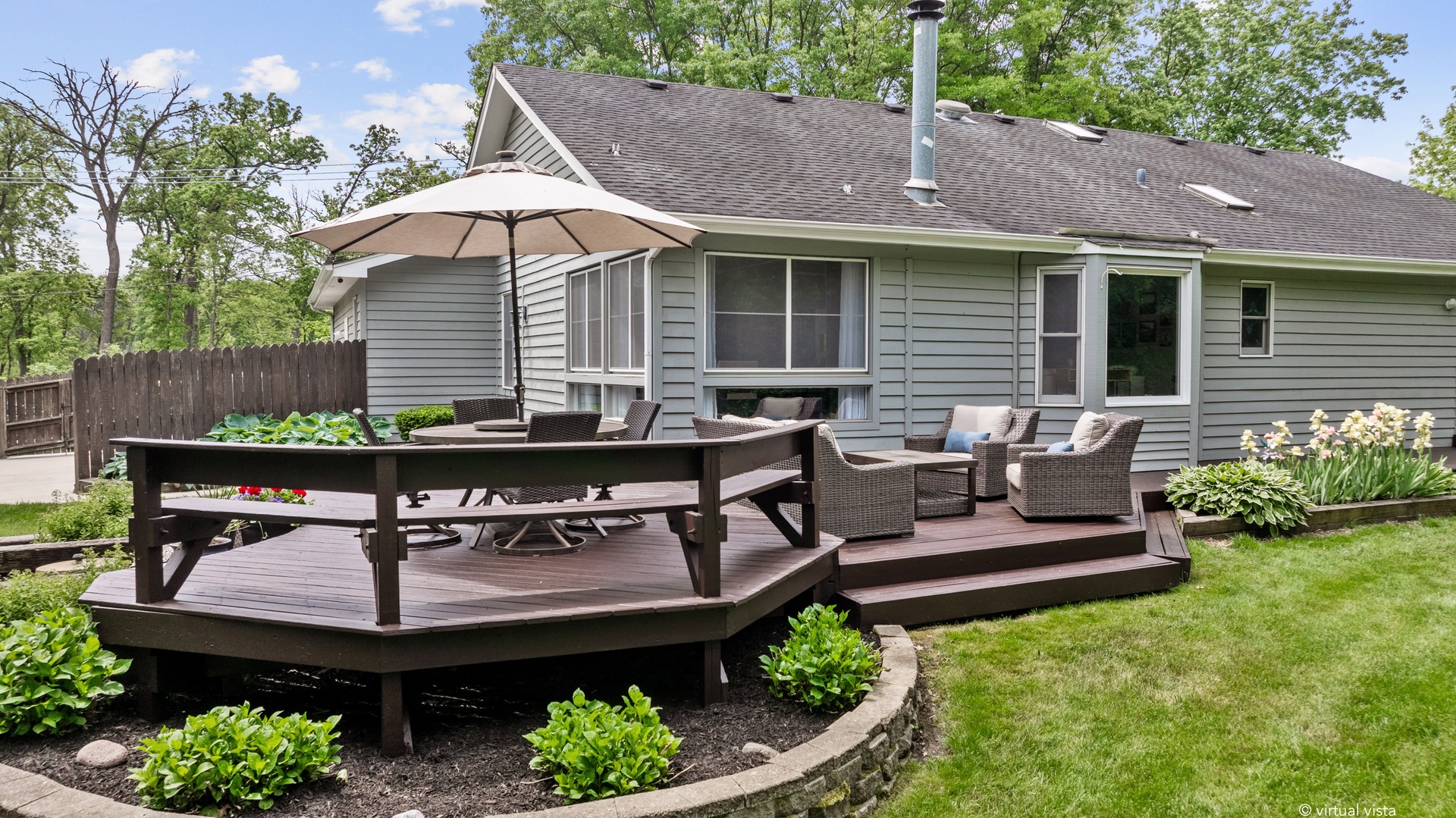 28W140 Mack Road Wheaton, IL 60189 - Photo 38 of 48 a view of a patio with table and chairs potted plants and a bench
