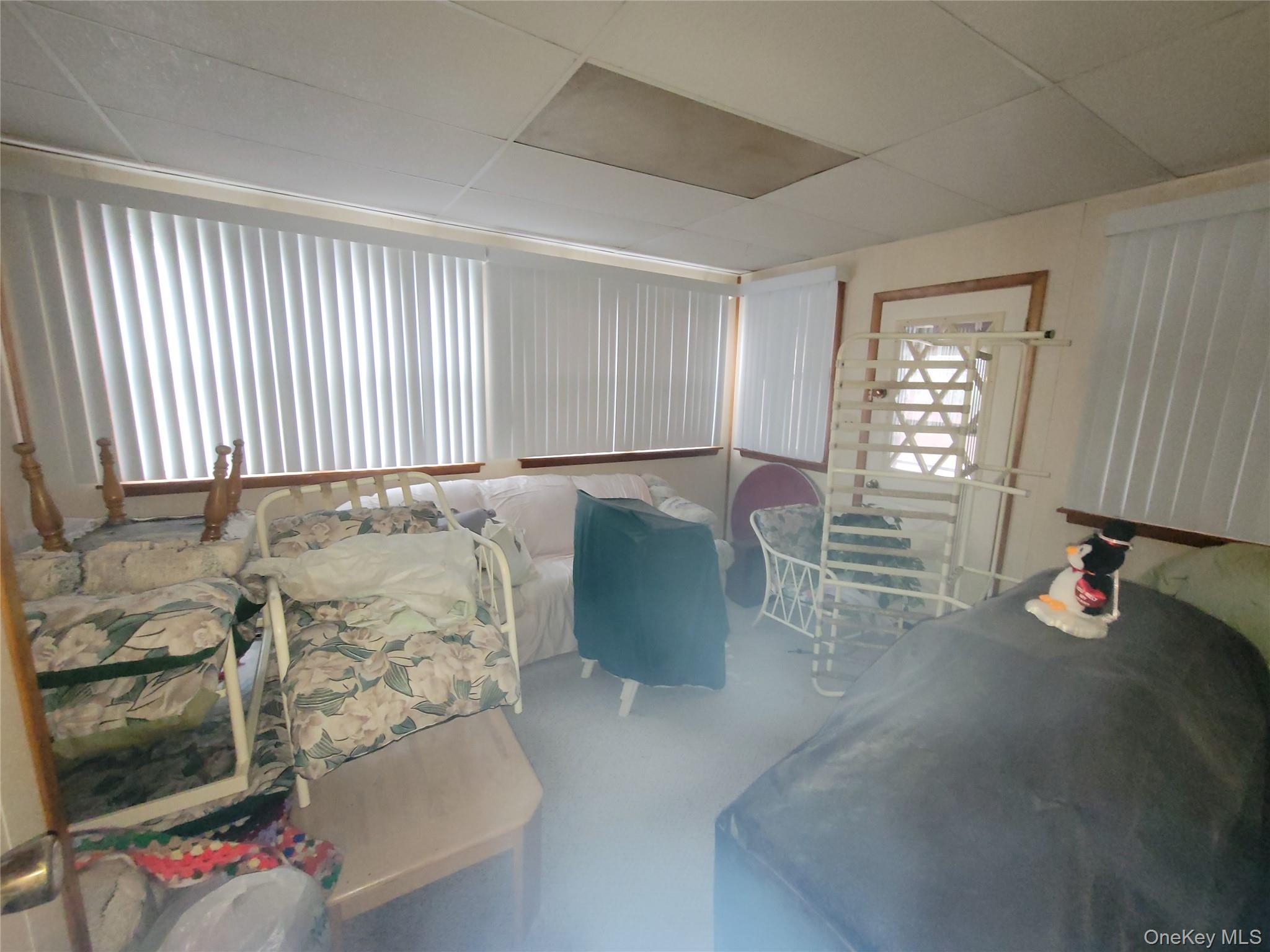 191 Hasbrouck A Road Fallsburg, NY 12747 - Photo 11 of 12 wooden floor and windows in a room