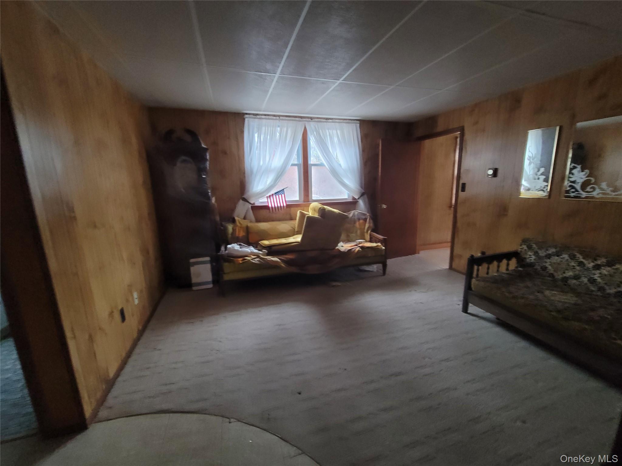 191 Hasbrouck A Road Fallsburg, NY 12747 - Photo 5 of 12 a living room with furniture and a window