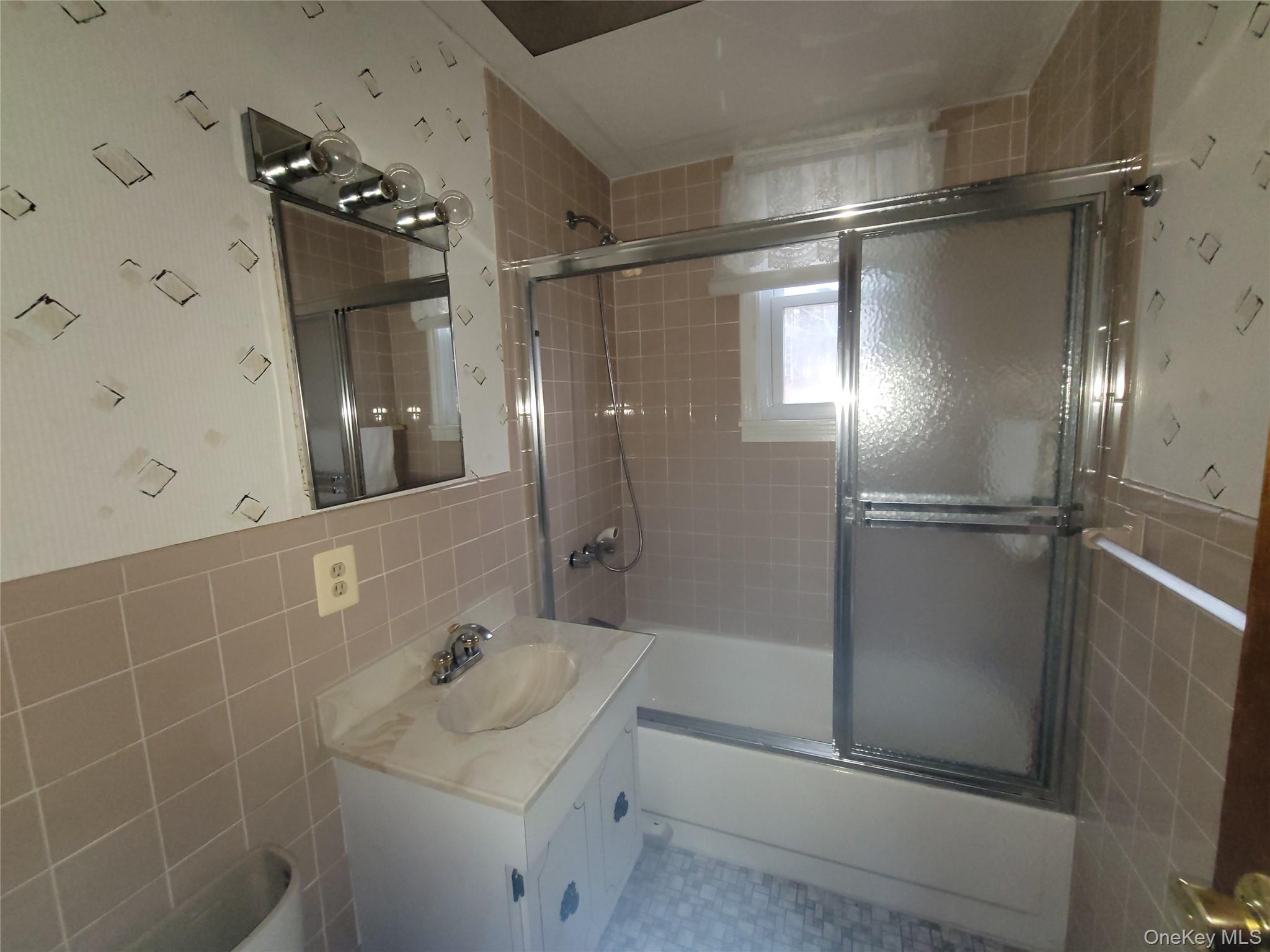 191 Hasbrouck A Road Fallsburg, NY 12747 - Photo 6 of 12 a bathroom with a sink mirror toilet and shower