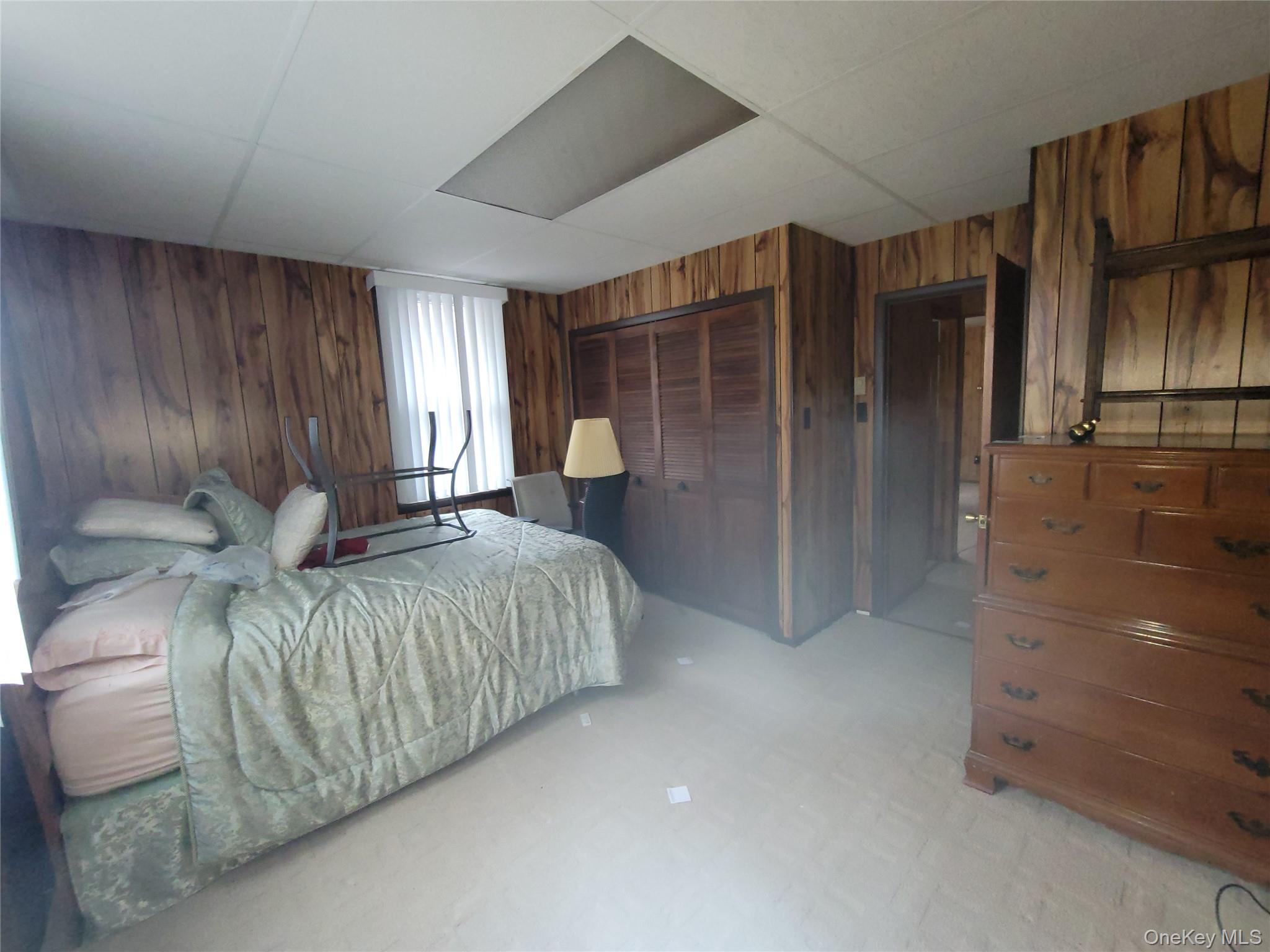 191 Hasbrouck A Road Fallsburg, NY 12747 - Photo 7 of 12 a bed room with a bed and a walk in closet