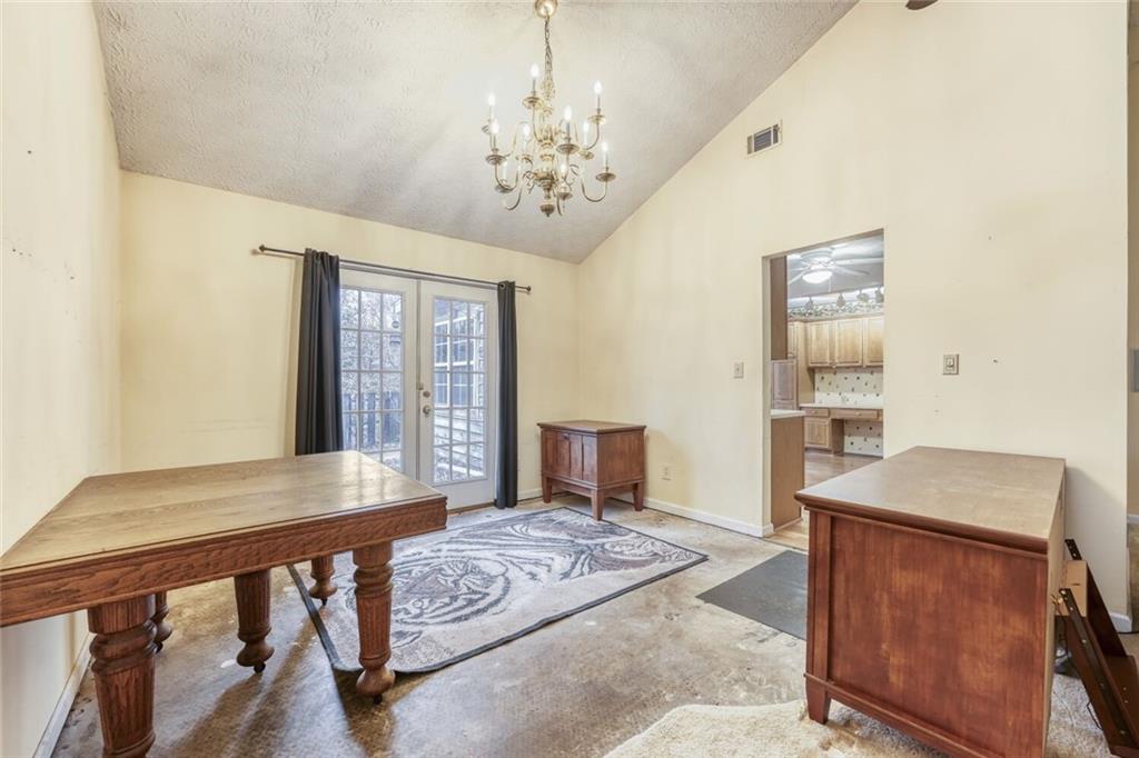 835 Greenvine Trace Roswell, GA 30076 - Photo 11 of 27 a bedroom with a bed and a dresser with wooden floor