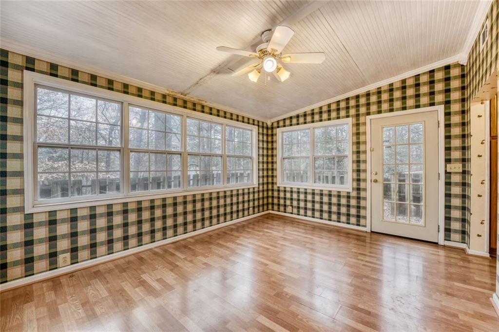 835 Greenvine Trace Roswell, GA 30076 - Photo 12 of 27 a view of an empty room with a window and wooden floor
