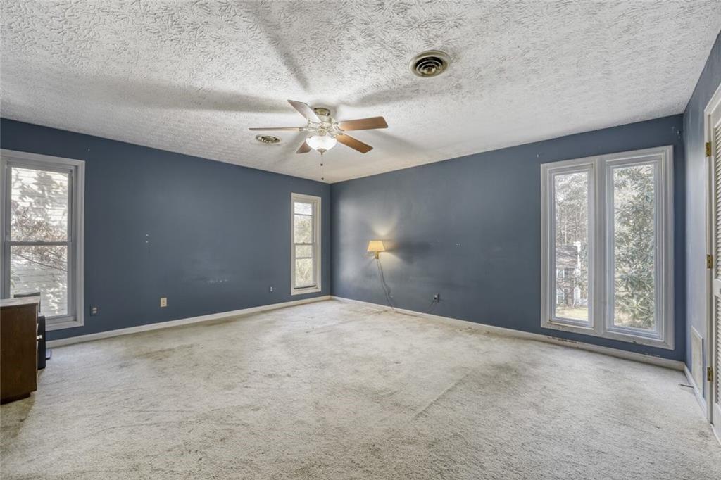 835 Greenvine Trace Roswell, GA 30076 - Photo 13 of 27 a view of an empty room with a window