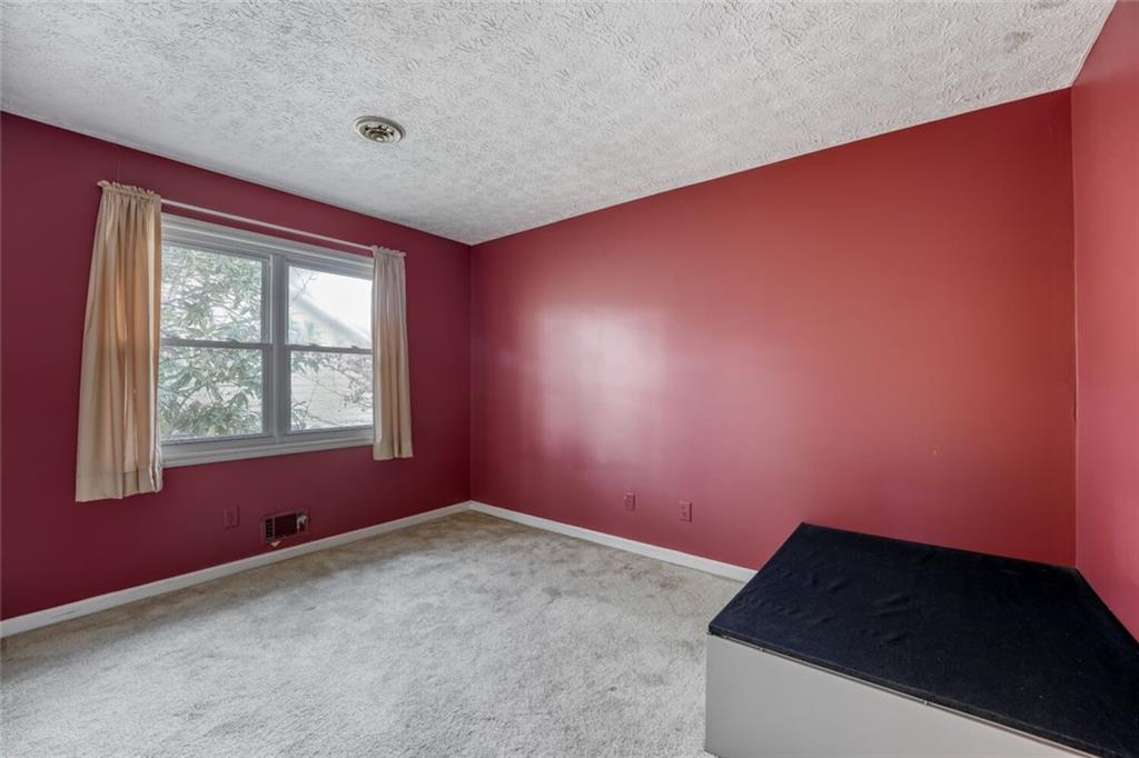835 Greenvine Trace Roswell, GA 30076 - Photo 16 of 27 an empty room with a window