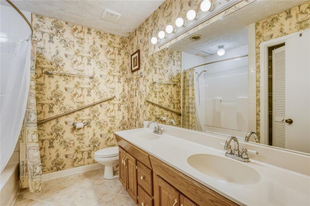 835 Greenvine Trace Roswell, GA 30076 - Photo 20 of 27 a bathroom with a sink toilet and shower
