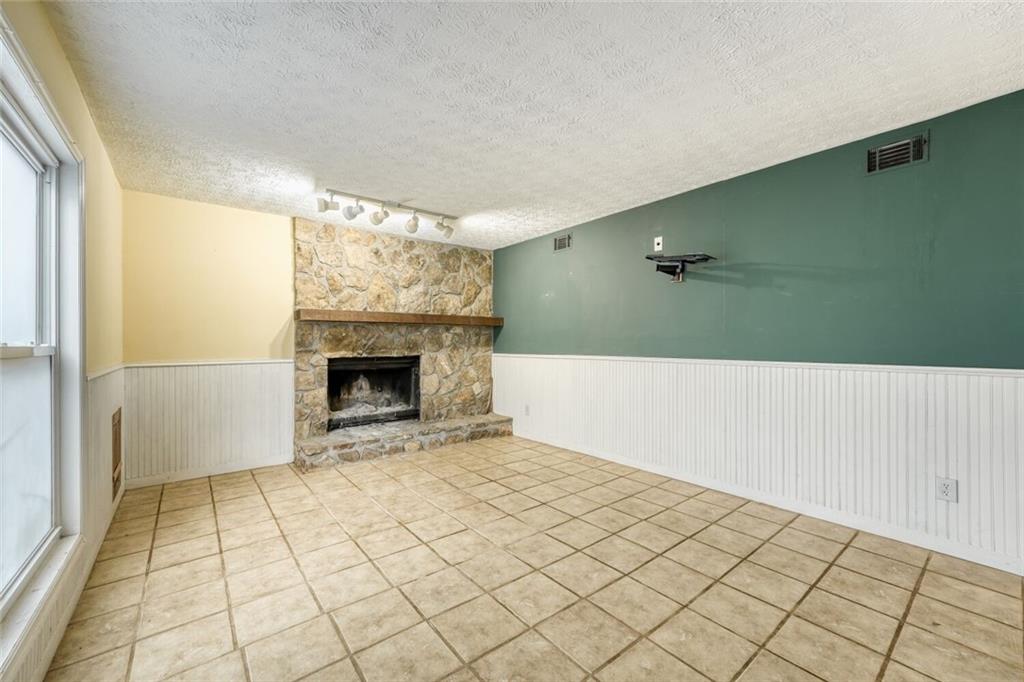 835 Greenvine Trace Roswell, GA 30076 - Photo 22 of 27 a view of an empty room with a fireplace