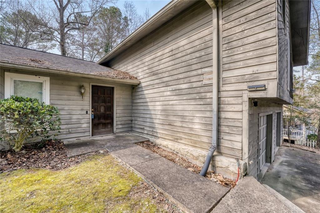 835 Greenvine Trace Roswell, GA 30076 - Photo 3 of 27 a view of house with backyard space and tree in the background