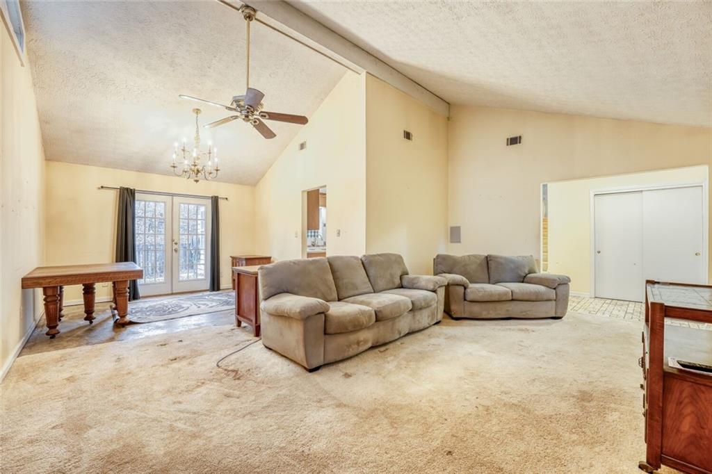 835 Greenvine Trace Roswell, GA 30076 - Photo 8 of 27 a living room with furniture and a window