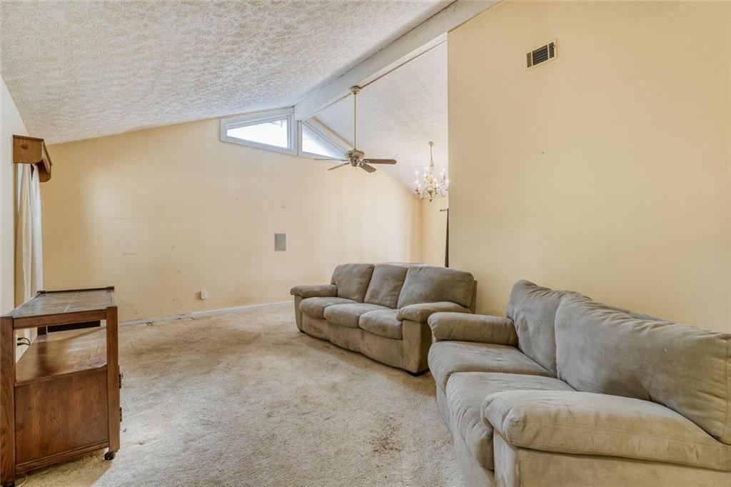 835 Greenvine Trace Roswell, GA 30076 - Photo 10 of 27 a living room with furniture and a air conditioner