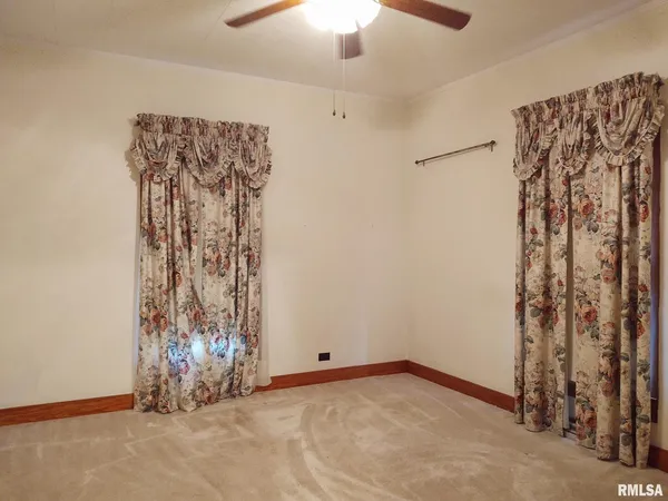 a view of a livingroom with a hanging space and a chandelier